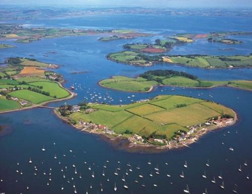 an aerial view of a group of islands in the water at School house Portaferry in Portaferry