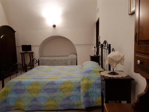 Ένα ή περισσότερα κρεβάτια σε δωμάτιο στο Masseria Cassiere
