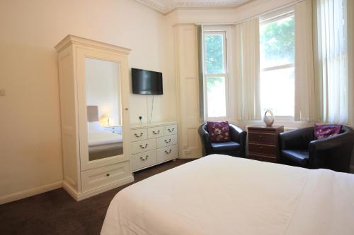 Säng eller sängar i ett rum på Seafield House