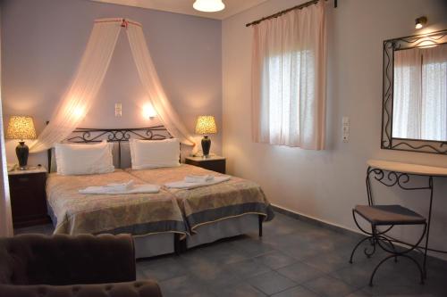 Postel nebo postele na pokoji v ubytování Melidron Hotel
