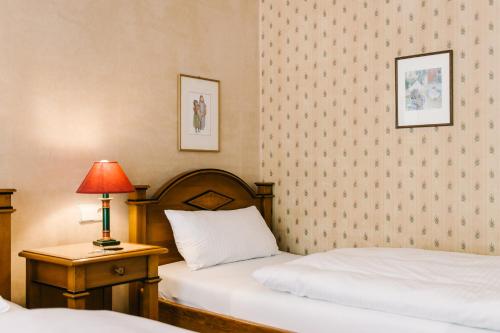Ένα ή περισσότερα κρεβάτια σε δωμάτιο στο Landhaus Keller - Hotel & Restaurant