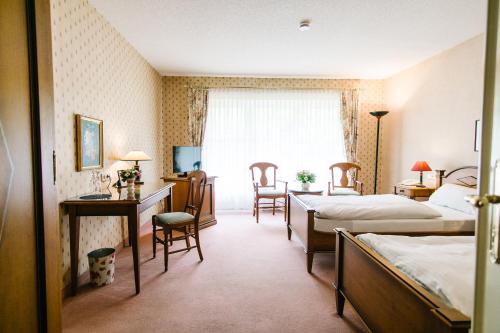 Ένα ή περισσότερα κρεβάτια σε δωμάτιο στο Landhaus Keller - Hotel & Restaurant