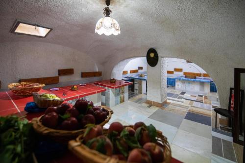 a kitchen with a table with a bowl of fruit at B&B Cappotto civico 48 in Pompei