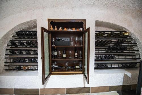 a room with a shelf of wine bottles at B&B Cappotto civico 48 in Pompei