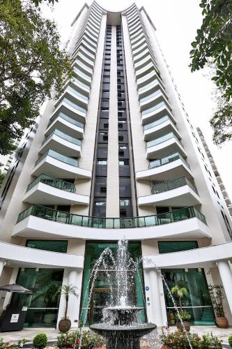 a tall building with a fountain in front of it at Transamerica Paradise Garden in Sao Paulo