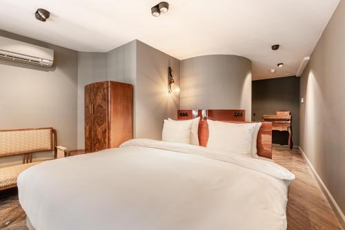 Un ou plusieurs lits dans un hébergement de l'établissement Boutique Hotel The Craftsmen