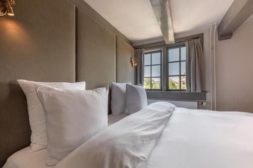 Un ou plusieurs lits dans un hébergement de l'établissement Boutique Hotel The Craftsmen