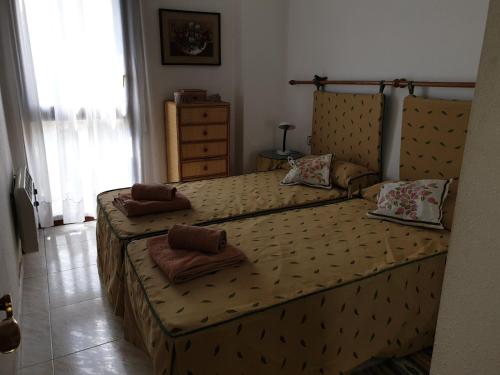 En eller flere senge i et værelse på VUT La Boticaria