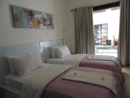 Säng eller sängar i ett rum på Casus Dream Hotel