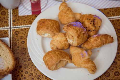 a plate of pastries on top of a table at Salma Hotel Cairo in Cairo