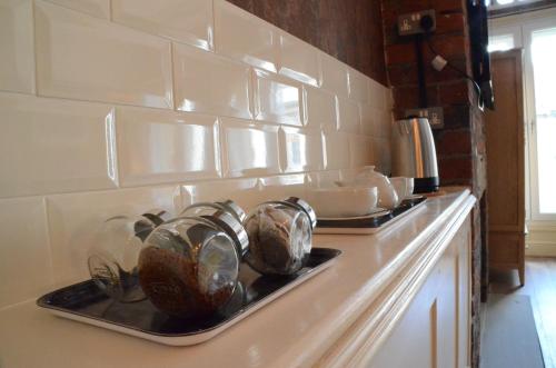 a kitchen counter with a tray of pots and pans at 43A Crown Street in Halifax