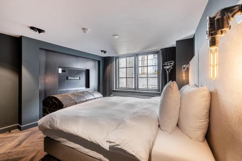 Un ou plusieurs lits dans un hébergement de l'établissement Boutique Hotel The Craftsmen