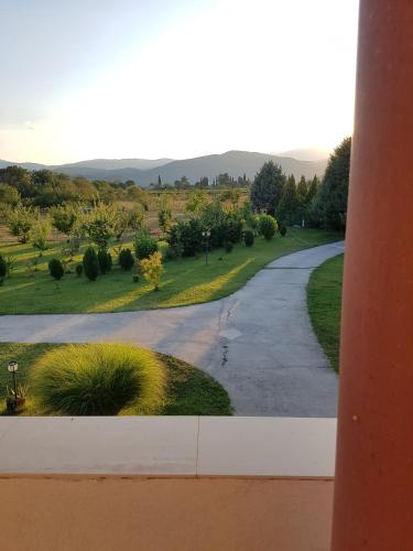 a view of a driveway with trees and grass at Villa Katerina & Pool in Gevgelija