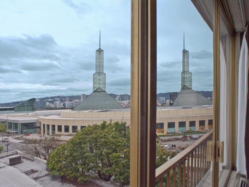 a view from a window of a building with three towers at Inn at the Convention Center in Portland