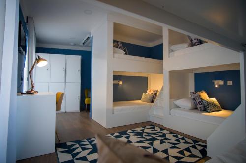 a small room with two bunk beds in it at ZIGZAG HOSTEL in Praia da Vitória