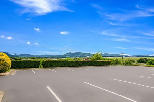 a parking lot with a blue sky in the background at Quality Inn Roanoke Airport in Roanoke