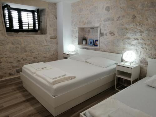 Postel nebo postele na pokoji v ubytování Steinhaus Dalmatien