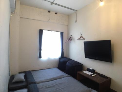 ゲストハウス Golden Mile Hostel にあるテレビまたはエンターテインメントセンター
