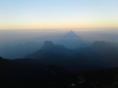a view of the blue mountains in the fog at Water Side Residence in Adams Peak