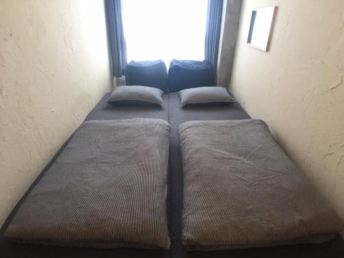 ゲストハウス Golden Mile Hostel にあるベッド