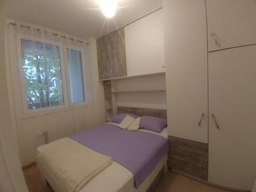 Ένα ή περισσότερα κρεβάτια σε δωμάτιο στο Apartman Ladybug