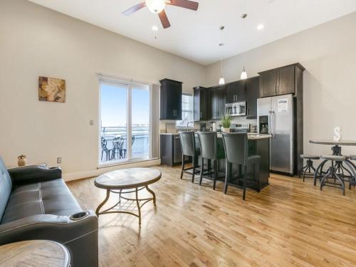 a living room with a couch and a table at Gorgeous Condos - Walk to French Quarter in New Orleans
