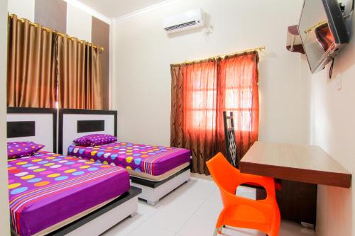 Ένα ή περισσότερα κρεβάτια σε δωμάτιο στο Trans Bandara Residence
