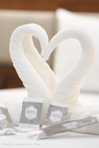 two swans shaped like hearts sitting on a table at Griffin Hotel and Suites in Cebu City