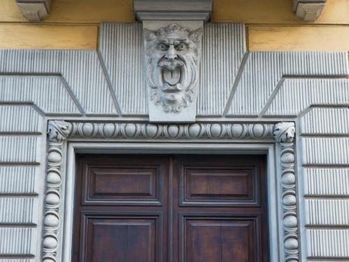 a building with a lion head above a door at The Right Place - Guest House in Rome