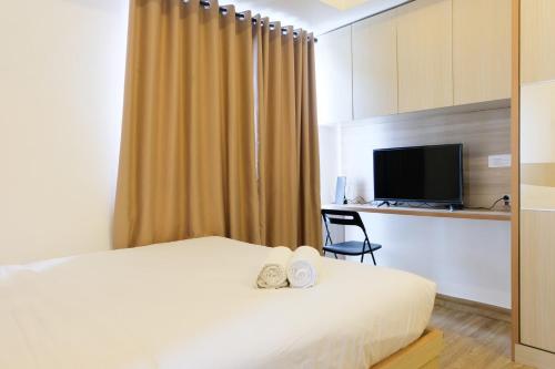 Ένα ή περισσότερα κρεβάτια σε δωμάτιο στο Cozy and Compact Casa De Parco Studio Apartment By Travelio