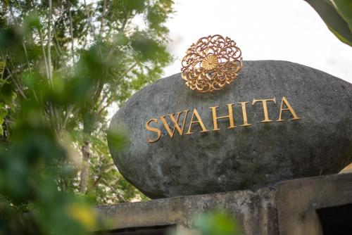 a sign for the swatchilusilusilusilusilusilus at Swahita Ubud in Ubud