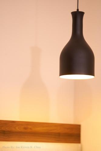 a black lamp and a vase on a shelf at Griffin Hotel and Suites in Cebu City