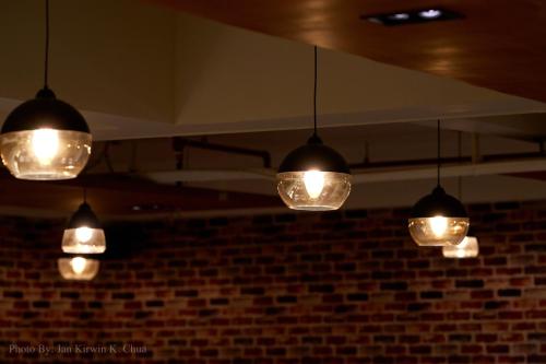 a bunch of lights hanging from a ceiling at Griffin Hotel and Suites in Cebu City