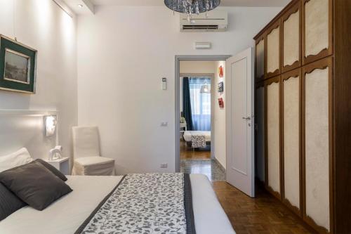 a bedroom with a large bed and a hallway at Dulcis In Vatican b&b in Rome