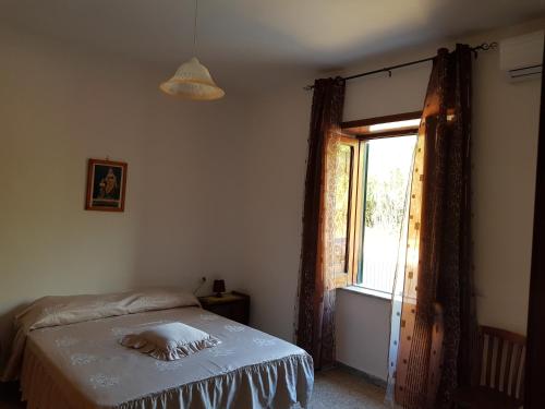 Letto o letti in una camera di abitazione bellavista