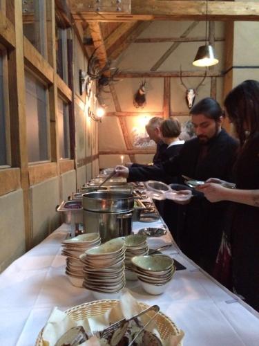 a buffet line with plates of food and people eating at Hotel Restaurant Mühlenhof Bosse in Dachwig