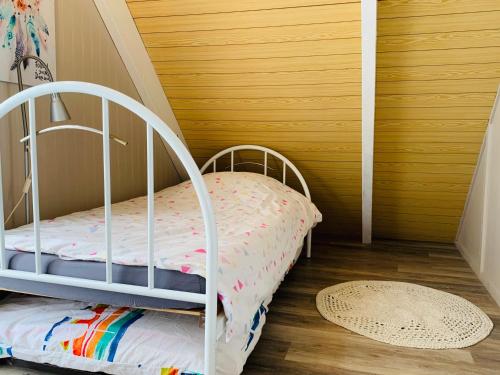 מיטה או מיטות בחדר ב-Chalet bord de mer 6 couchages
