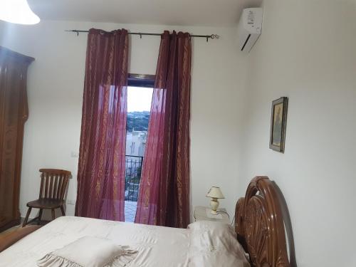 Letto o letti in una camera di abitazione bellavista