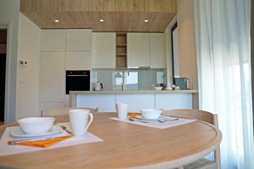 a kitchen with a table with two bowls on it at Regentova Suites Ljubljana in Ljubljana