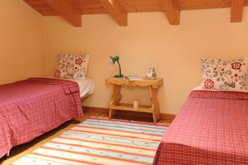 En eller flere senge i et værelse på La Casa Del Gelsomino