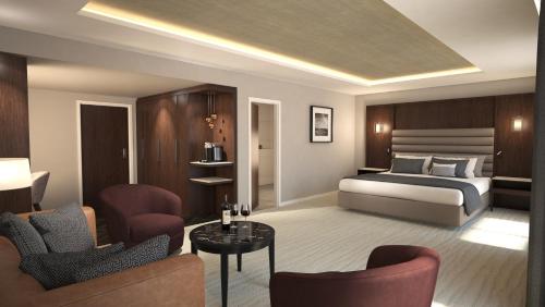a bedroom with a bed and a living room at Crow Wood Hotel & Spa Resort in Burnley