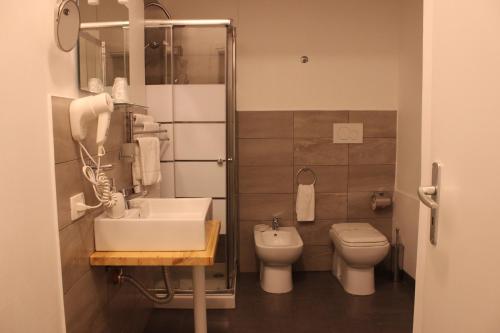 a bathroom with a sink and a toilet at Umberto House Catania in Catania