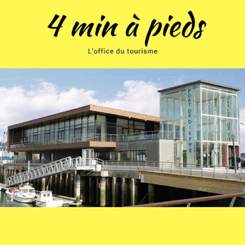 a building with a bridge next to a river at 1 appartement 2 chambres plus salon ,3 appartements rénovés , NETFLIX, lits faits à votre arrivée, serviettes de toilette, Ménage, Wifi, en hyper centre ,Plage à 190m, BOX à Vélos, paiement 3 fois sans frais, prix tout compris in Dieppe