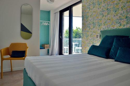 Ένα ή περισσότερα κρεβάτια σε δωμάτιο στο Villa Verna Agriresort