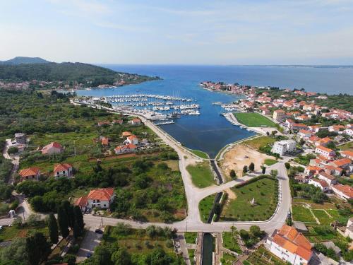 an aerial view of a town with a marina at Senkini Dvori in Sutomišćica