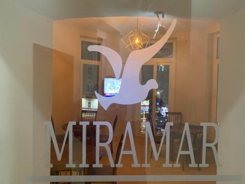 a sign in the window of a marmar restaurant at Miramar Talaat Harb Square in Cairo