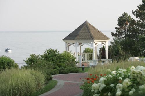a gazebo on the shore of a lake at Waters Edge Resort and Spa TimeShare in Westbrook