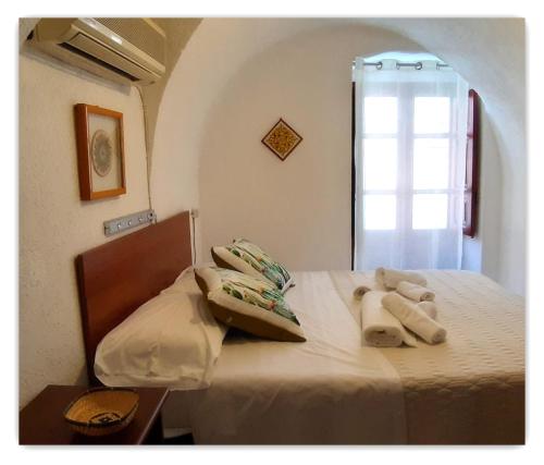 a bedroom with a bed with two teddy bears on it at Casa Giavada Steripinto in Sciacca