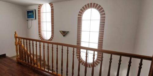a staircase with two mirrors on the wall at Villa Arcos in Segur de Calafell
