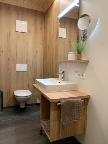 a bathroom with a sink and a toilet at Kererhof in Kals am Großglockner